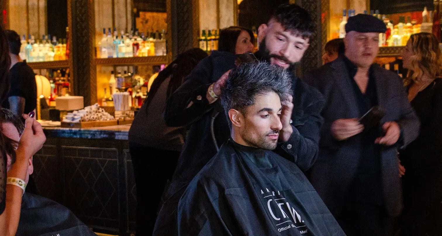 Victor Hugo Styling Client's Hair at American Crew Event